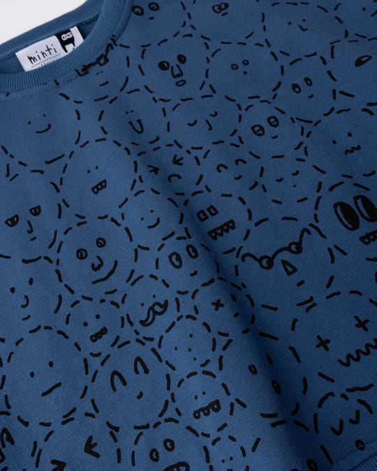 Close up of the Different Faces Short Sleeve Crew print in navy, grey marle and orange