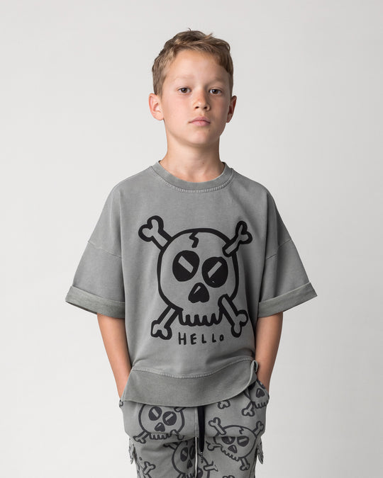 Close up of the Hello Skull Short Sleeve Crew in grey wash on a kid, front view