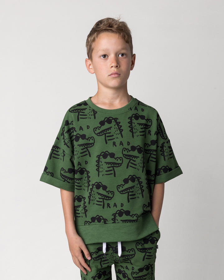 Close up of the Rad Croc Short Sleeve Crew in green on a kid, front view