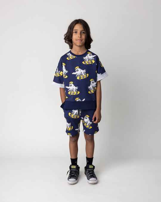 Kid wearing the Skate Ghost Short Sleeve Crew in dark blue with the Skate Ghost Short in dark blue, front view