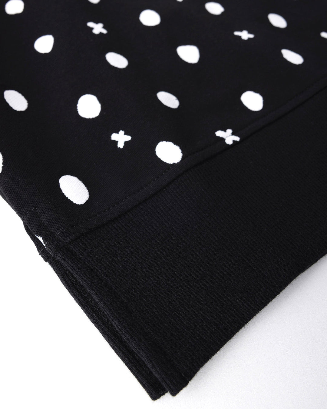 Close up detail of the Spotty Short Sleeve Crew in black