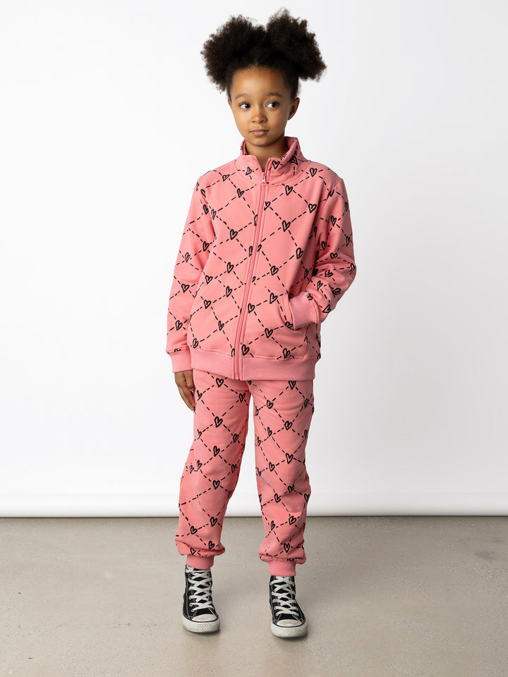 Minti kids clothing. Super cosy and soft zip up high neck crew with 2x2 Rib cuffs and hem. Front kangaroo pocket to keep hands warm. 330 Gram // Brushed Inside // 95% Cotton // 5% Elastane.
