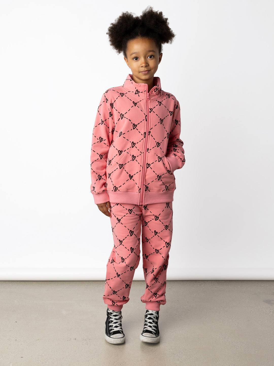 Minti kids clothing. Super cosy and soft zip up high neck crew with 2x2 Rib cuffs and hem. Front kangaroo pocket to keep hands warm. 330 Gram // Brushed Inside // 95% Cotton // 5% Elastane.