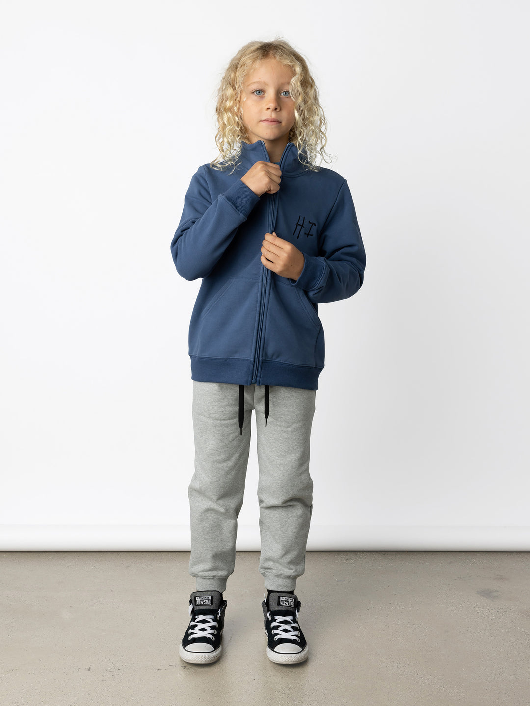 Minti kids clothing. Super cosy and soft zip up high neck crew with 2x2 Rib cuffs and hem. Front kangaroo pocket to keep hands warm. 330 Gram // Brushed Inside // 95% Cotton // 5% Elastane.