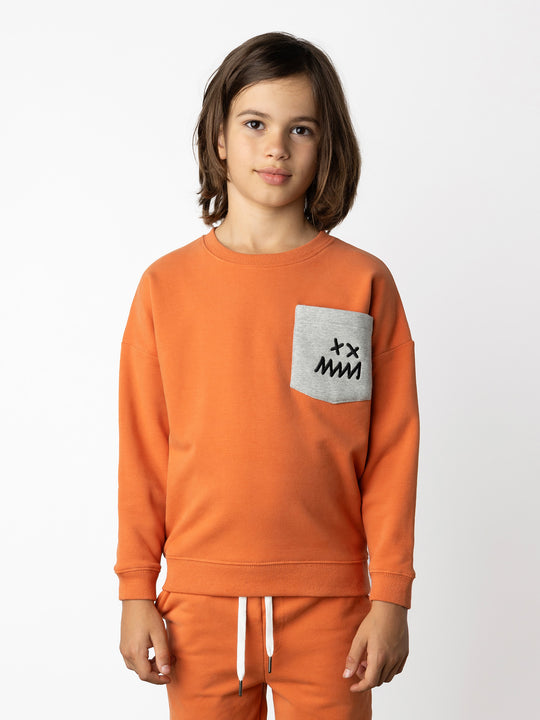 Minti kids clothing. Super cosy oversized fit crew with drop shoulder detail and cool front pocket. 2x2 Rib at the neck, hem and cuffs. 330 Gram // Brushed Inside // 95% Cotton // 5% Elastane.