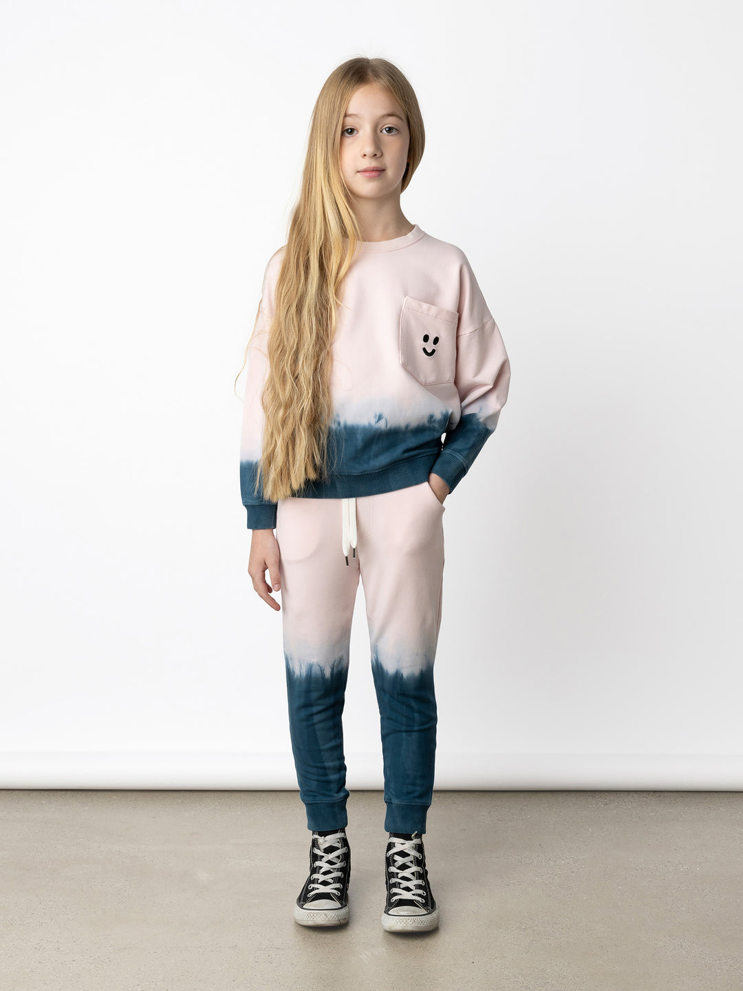 Minti kids clothing. Super cosy oversized fit crew with drop shoulder detail and cool front pocket. 2x2 Rib at the neck, hem and cuffs. 320 Gram // 95% Cotton // 5% Elastane.