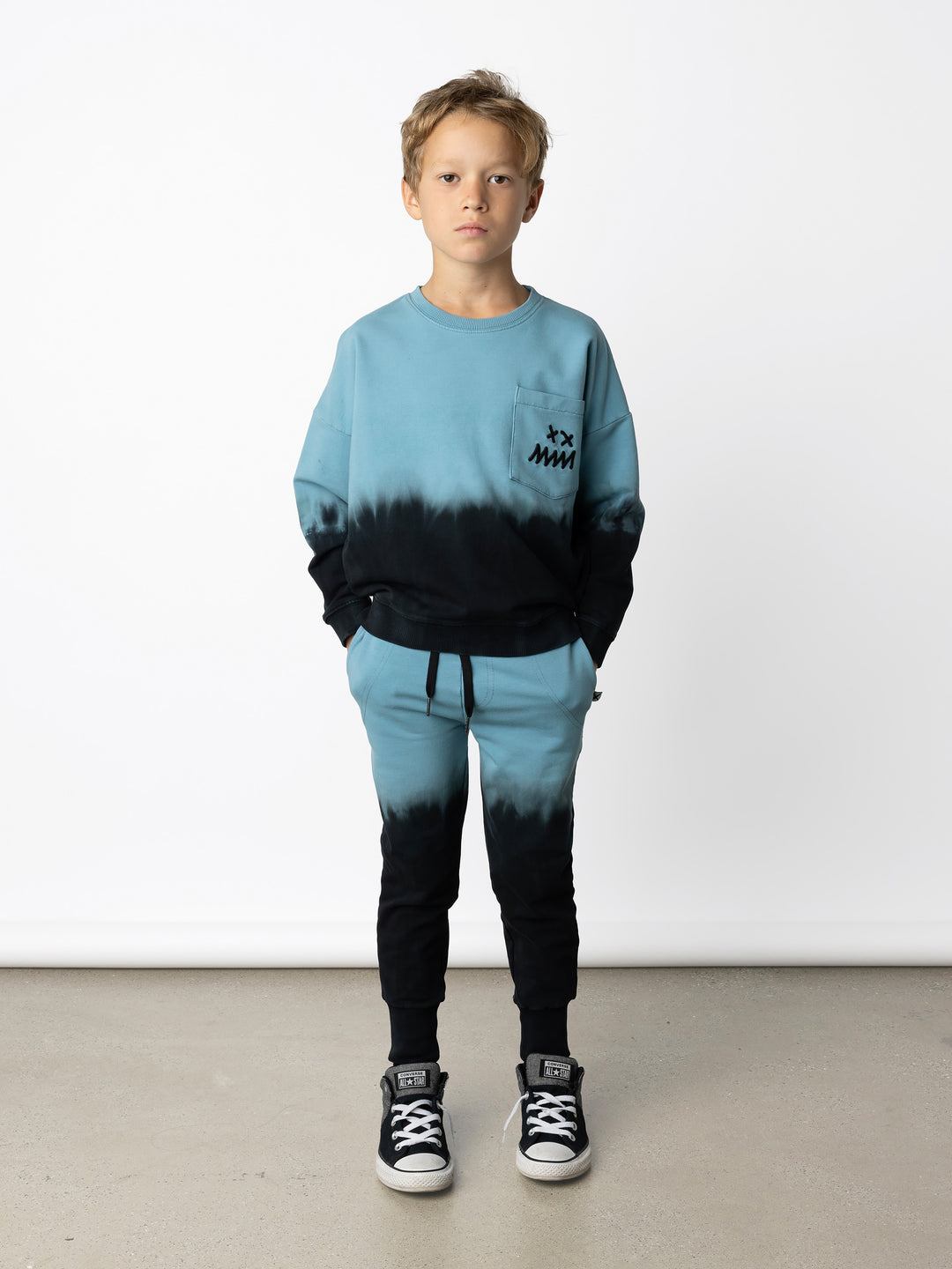 Minti kids clothing. Super cosy oversized fit crew with drop shoulder detail and cool front pocket. 2x2 Rib at the neck, hem and cuffs. 320 Gram // 95% Cotton // 5% Elastane.
