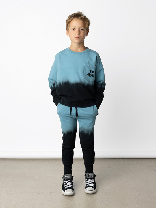 Minti kids clothing. Super cosy oversized fit crew with drop shoulder detail and cool front pocket. 2x2 Rib at the neck, hem and cuffs. 320 Gram // 95% Cotton // 5% Elastane.