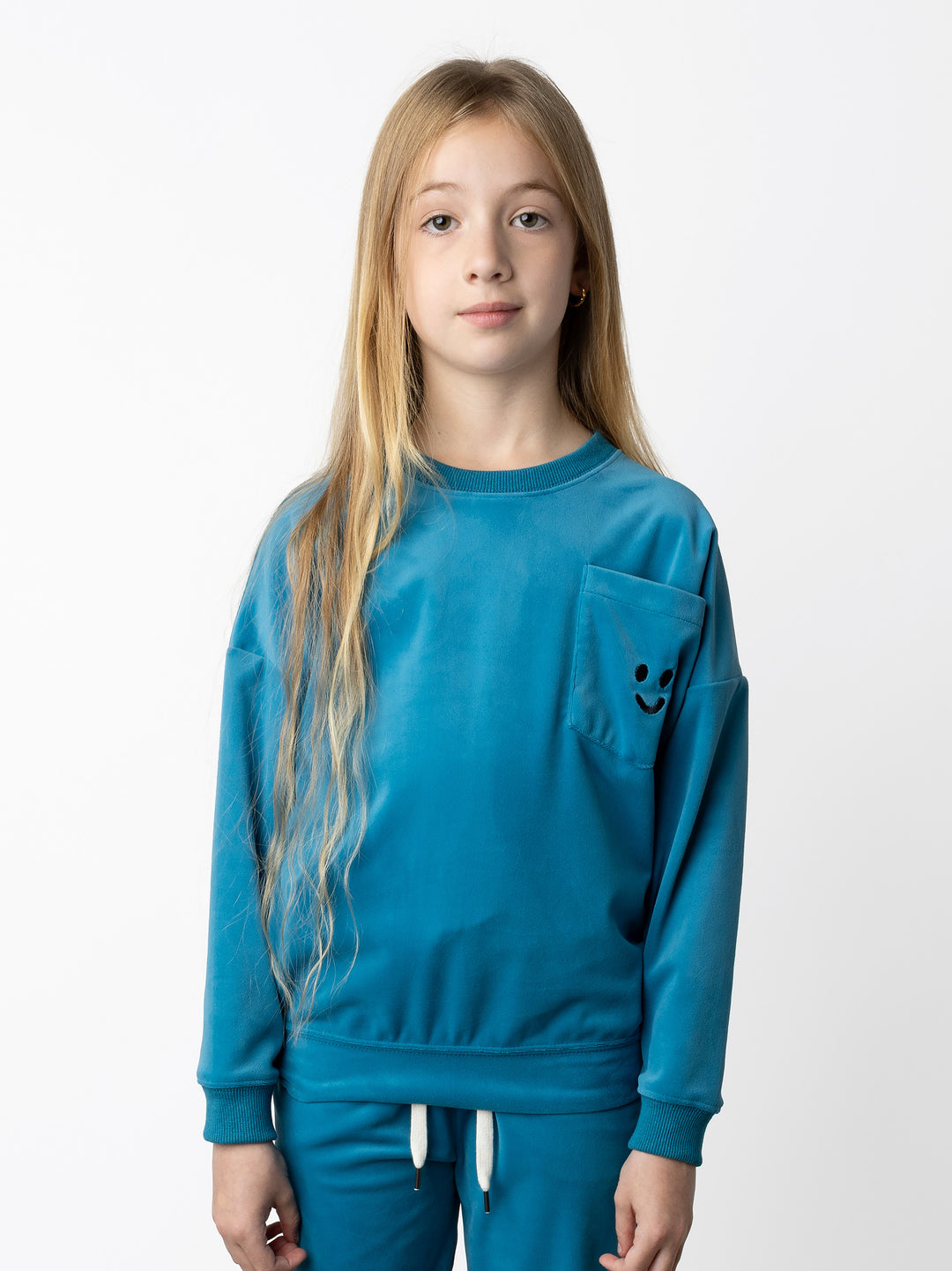 Minti kids clothing. Super cosy oversized fit crew with drop shoulder detail and cool front pocket. 2x2 Rib at the neck, hem and cuffs. 92% Polyester // 8% Spandex.