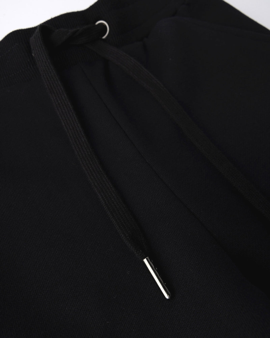 Close up detail of the Studio Trackies in black