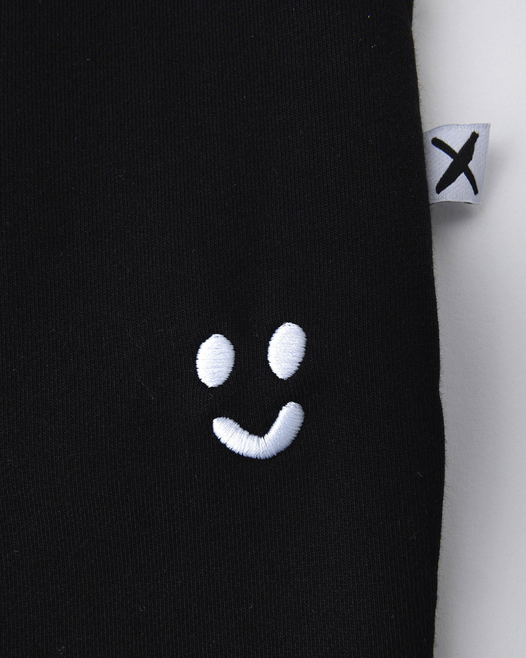 Close up detail of the Studio Trackies in black
