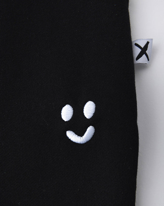 Close up detail of the Studio Trackies in black