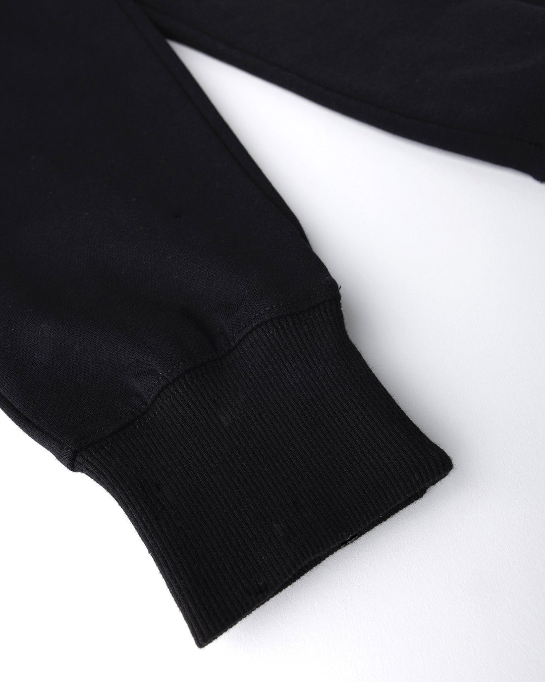 Close up detail of the Studio Trackies in black