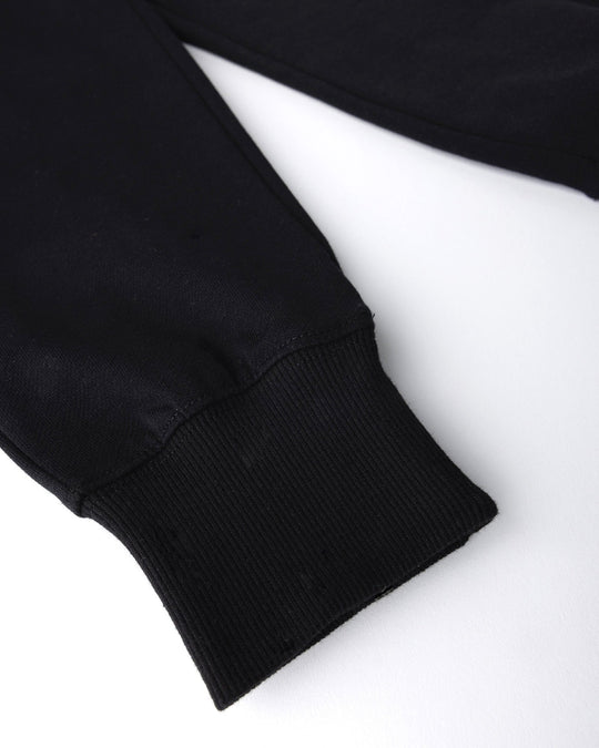 Close up detail of the Studio Trackies in black