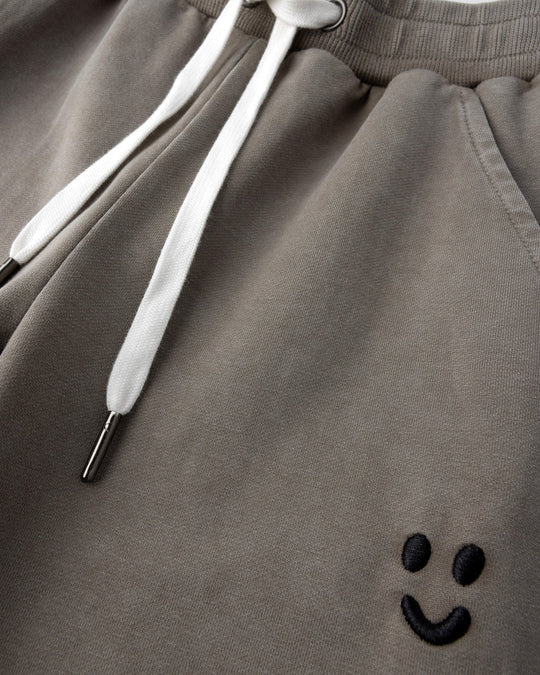 Close up detail of the Blasted Studio Trackies in grey wash
