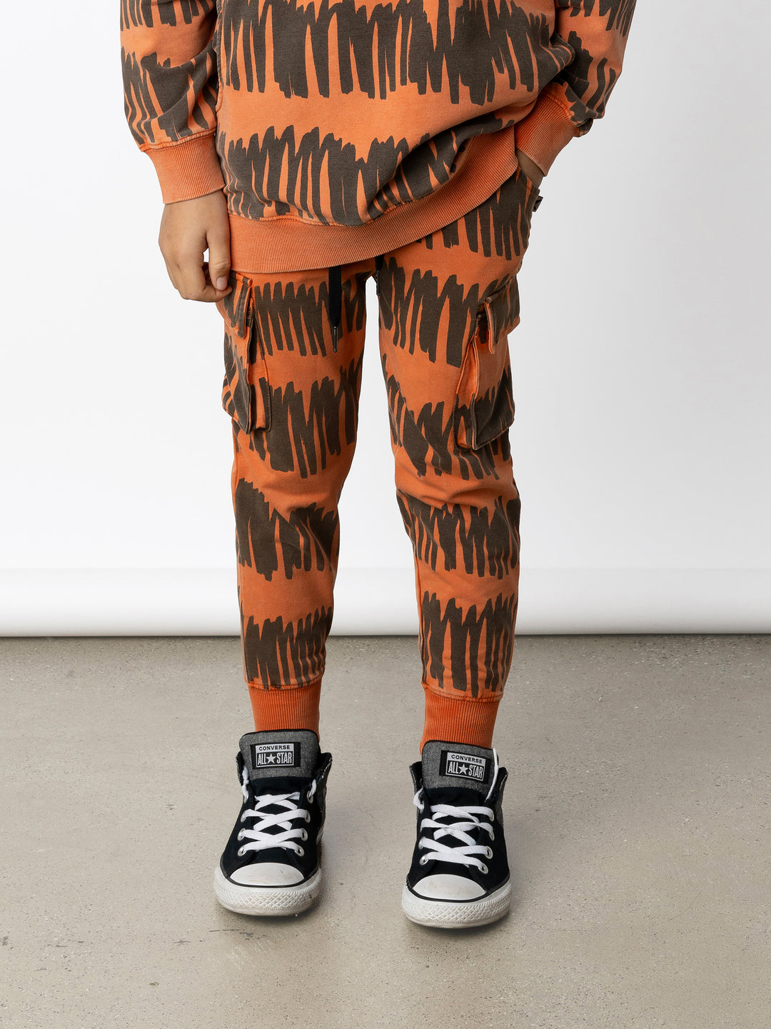 Minti kids clothing. Straight leg trackies with front pockets, elasticated waistband, 2x2 rib on waistband and cuffs and super cool cargo pockets for treasures! 260 Gram // 95% Cotton // 5% Elastane.