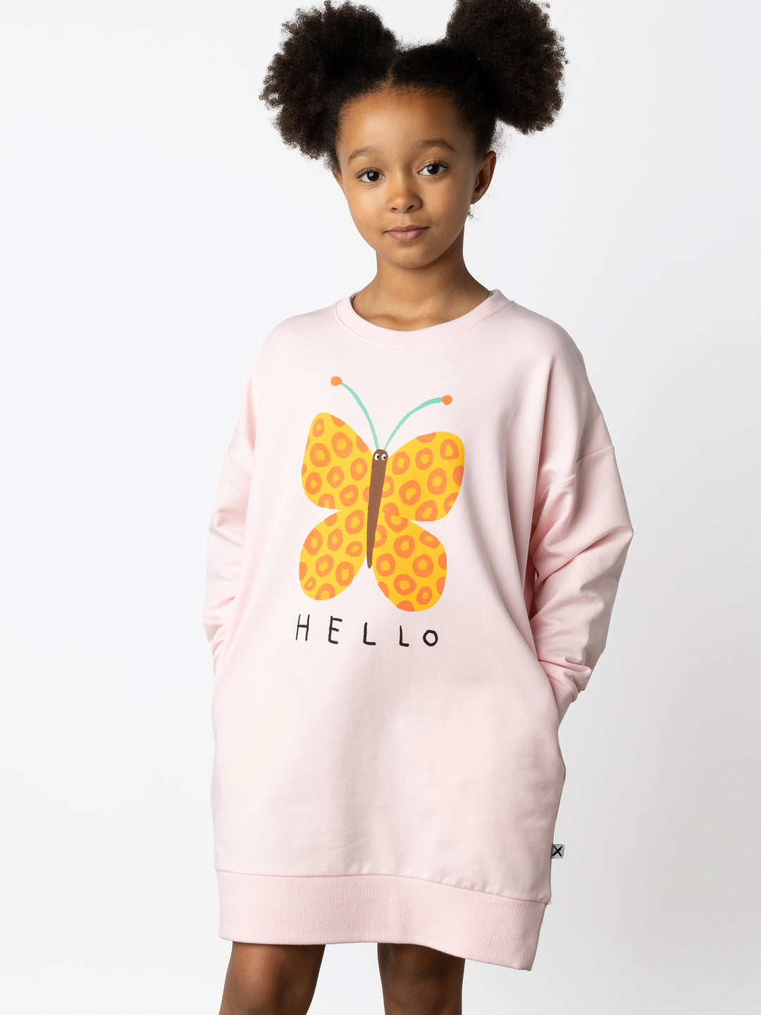 Minti kids clothing. Super cosy sweatshirting weight dress with drop shoulder detail. 2x2 Rib at the neck, hem and cuffs. Hidden side pockets. Print on the front and the back. 320 Gram // 95% Cotton // 5% Elastane.