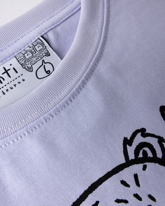 Close up detail of the Bear Hug Tee in lilac, lemon and blue
