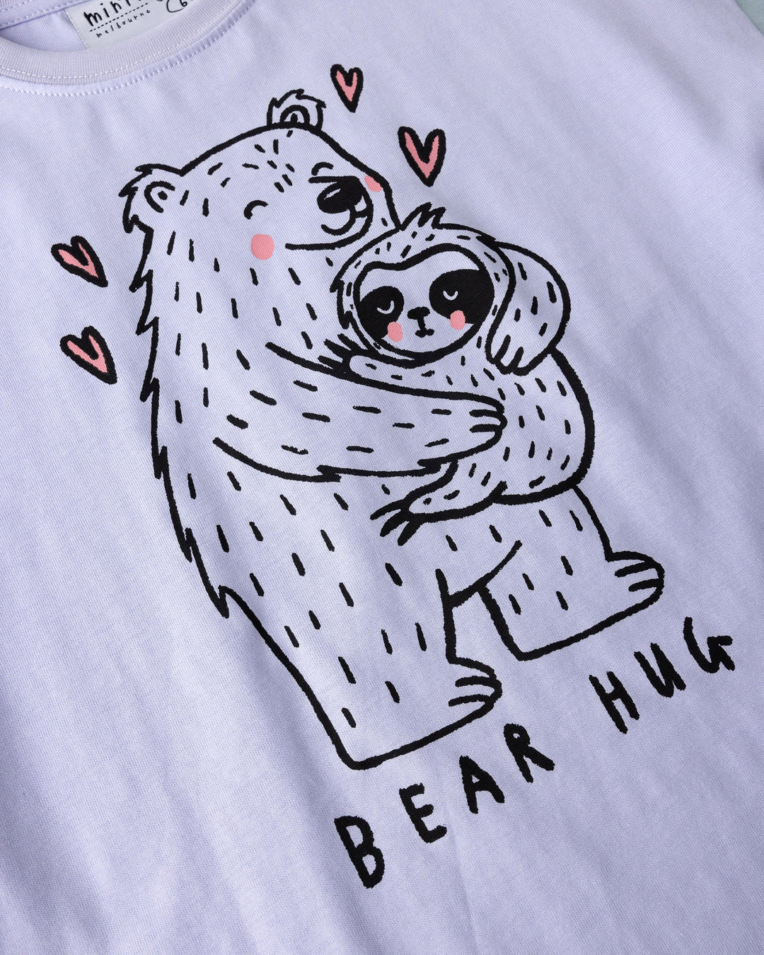 Close up of the Bear Hug Tee print in lilac, lemon and blue