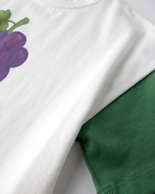 Close up detail of the Biking Grape Tee in white, purple and green