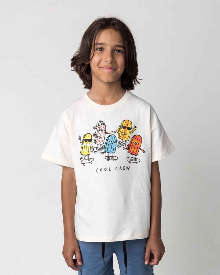 Close up of the Cool Crew Tee in cream on a kid, front view