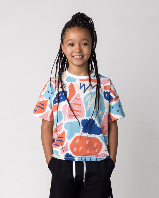 Close up of the Cool Shapes Tee in white on a kid, front view