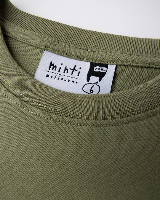 Close up detail of the Dino Ride Tee in light khaki