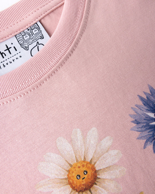 Close up of the Flower Friends Tee print in muted pink