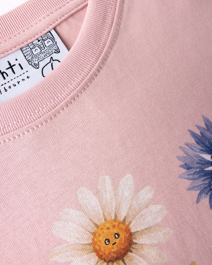 Close up of the Flower Friends Tee print in muted pink