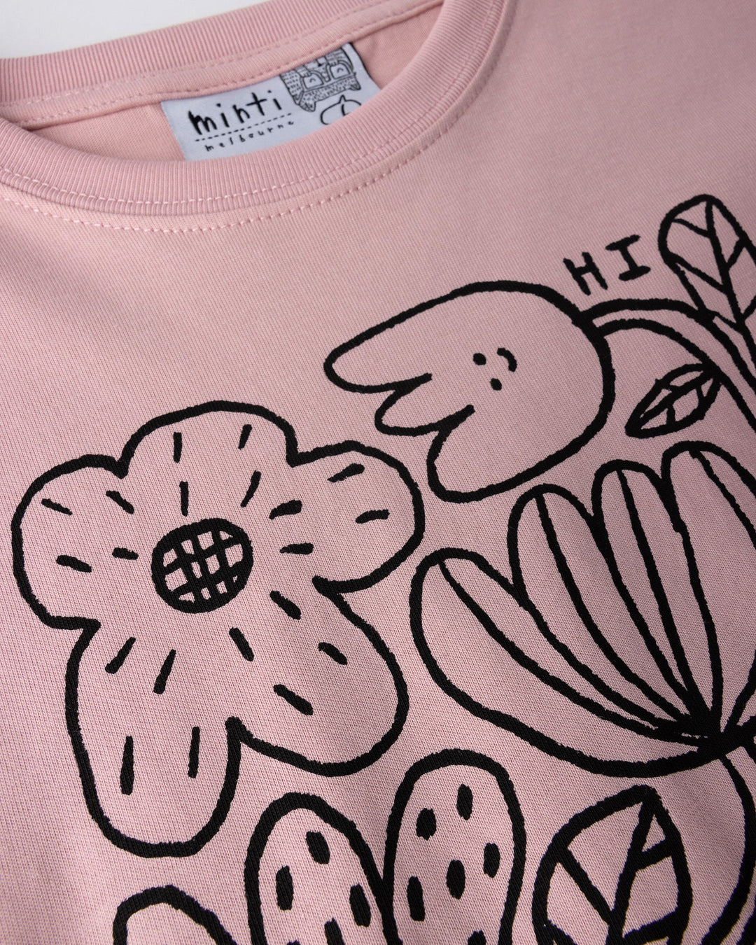 Close up of the Flower Party Tee print in muted pink