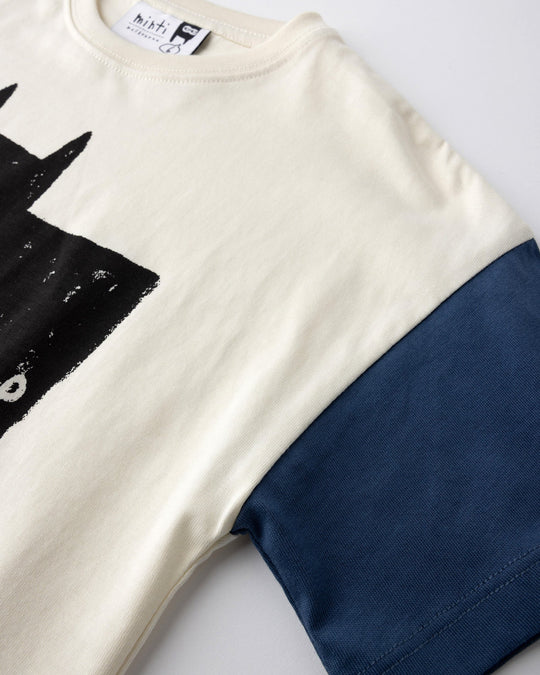 Close up detail of the Greetings Bat Tee in cream, black and midnight