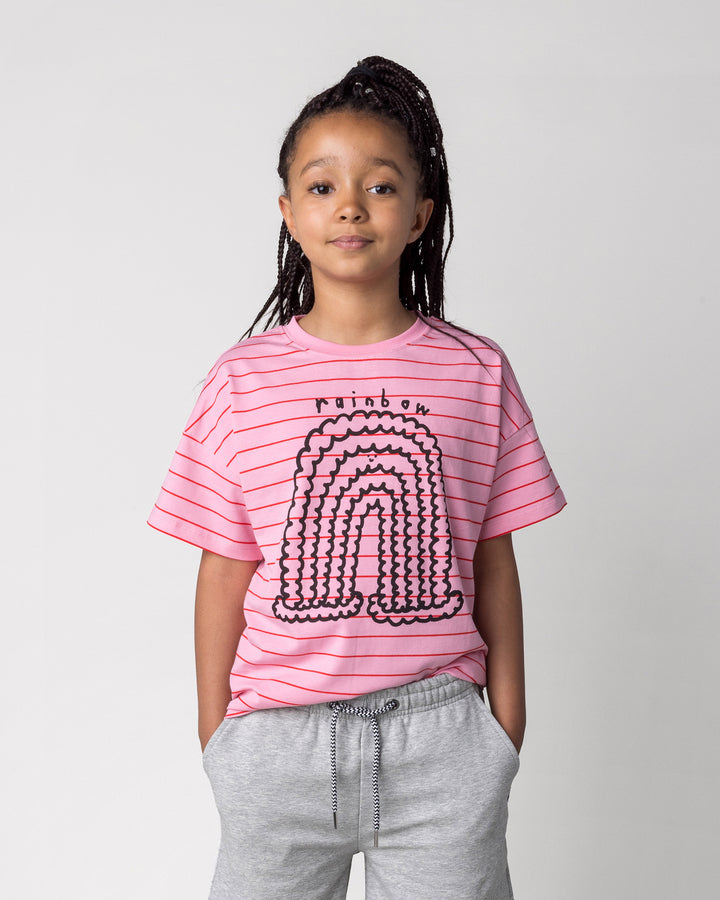 Close up of the Happy Rainbow Tee in pink and red stripe on a kid, front view