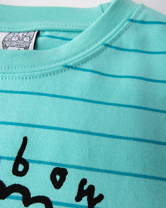 Close up detail of the Happy Rainbow Tee in teal stripe