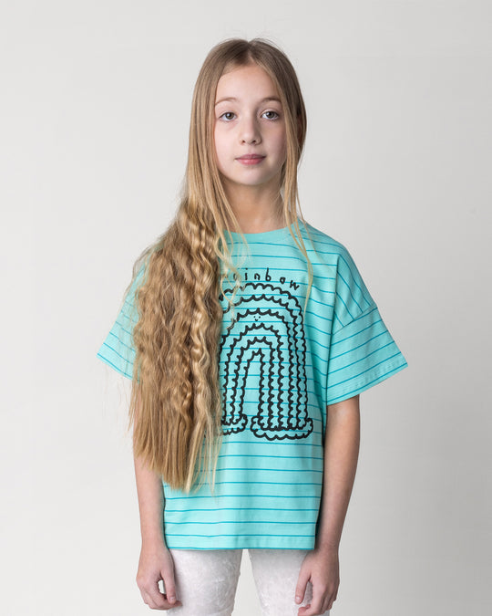 Close up of the Happy Rainbow Tee in teal stripe on a kid, front view