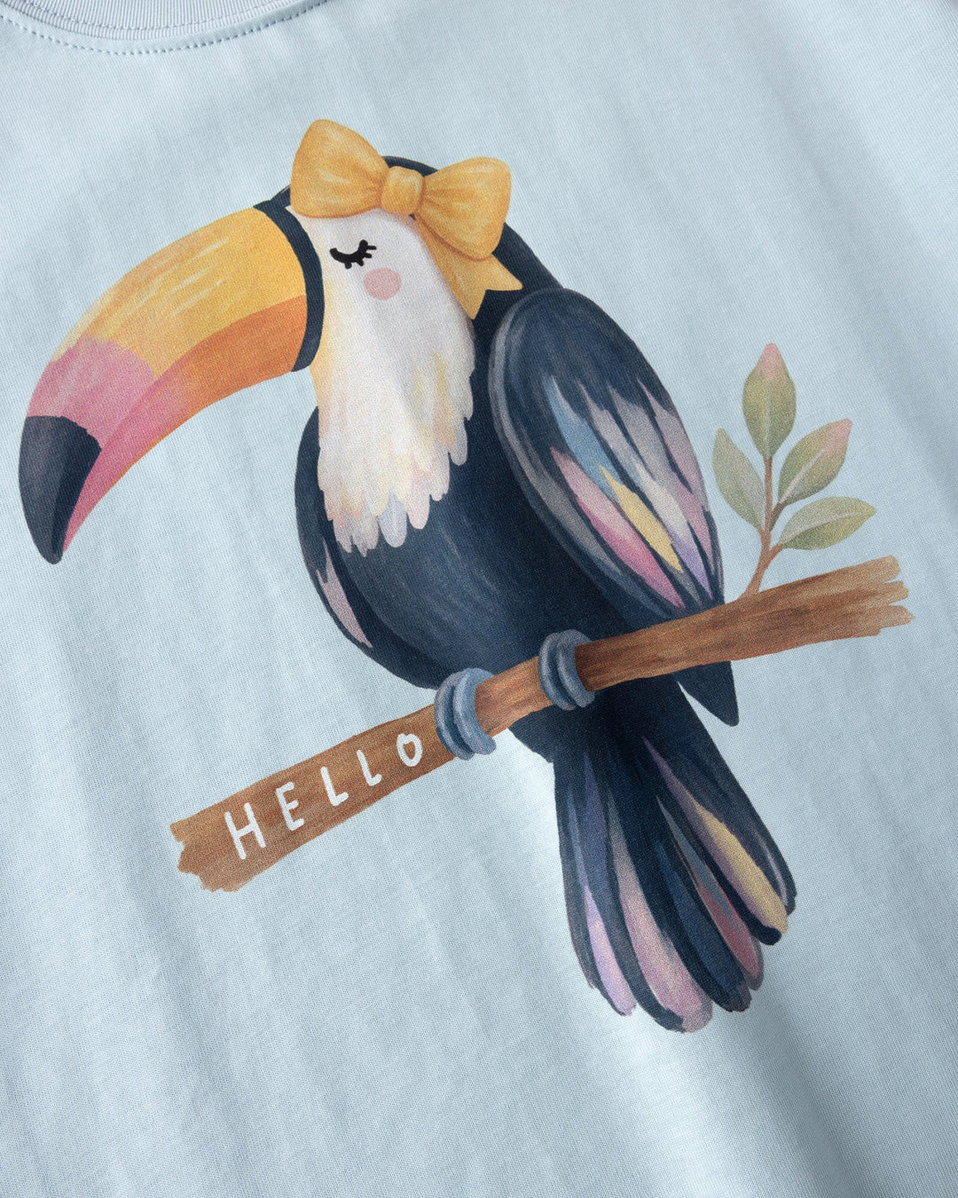 Close up of the Hello Toucan Tee print in light blue