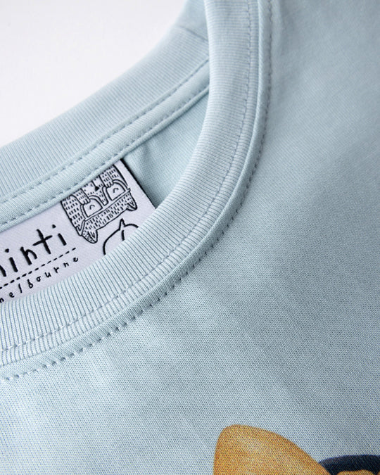 Close up detail of the Hello Toucan Tee in light blue