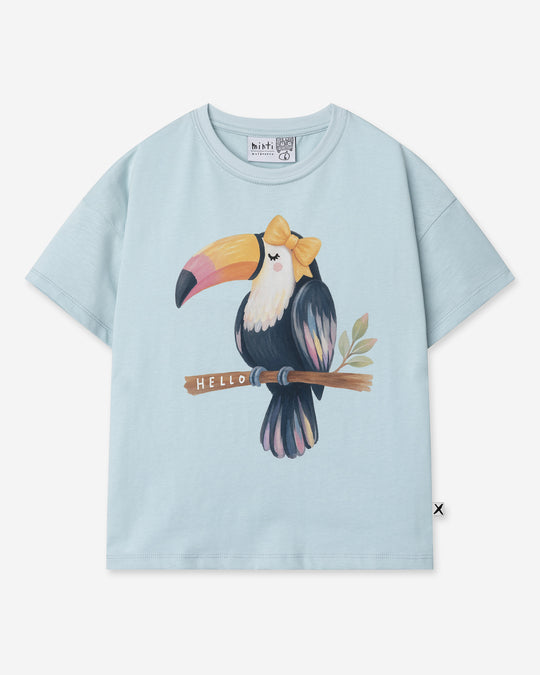 Hello Toucan Tee in light blue, girls t shirt by Minti, flat lay