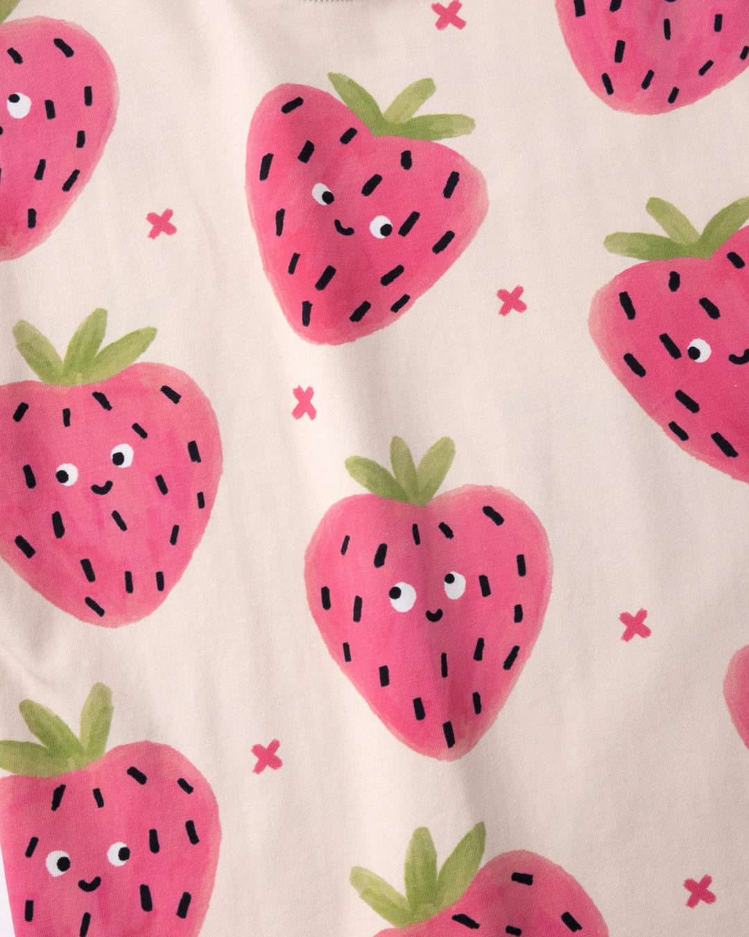 Close up of the Happy Strawberry Tee print in cream