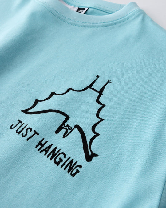 Close up of the Just Hanging Tee print in light aqua
