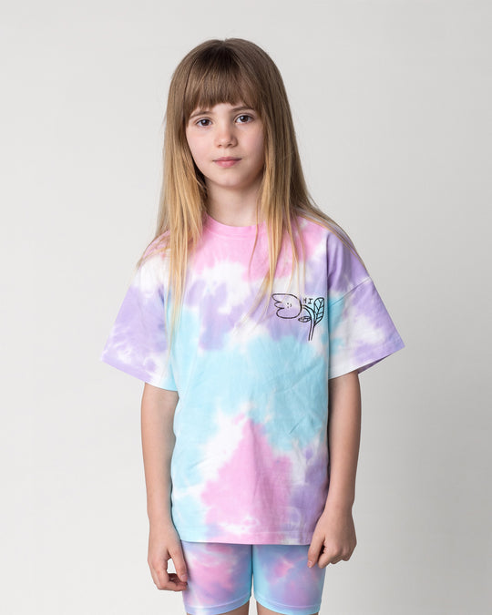 Close up of the Pocket Flower Tee in tie dye on a kid, front view