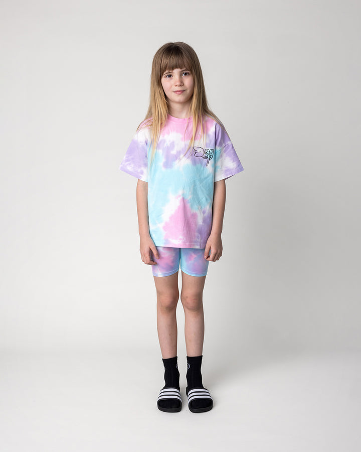 Kid wearing the Pocket Flower Tee in tie dye with the Tie Dye Bike Pant in multi, front view