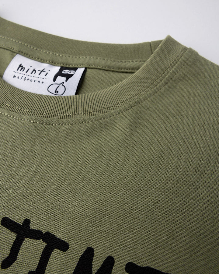 Close up detail of the Part Time Super Hero Tee in light khaki