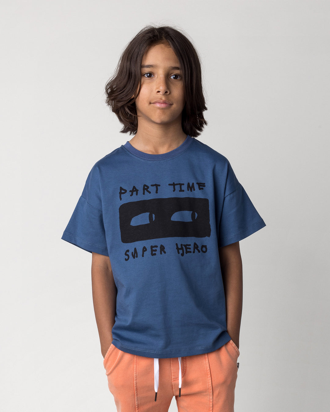 Close up of the Part Time Super Hero Tee in midnight on a kid, front view