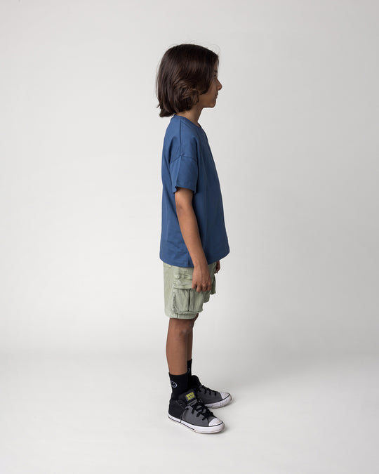 Kid wearing the Rad Croc Tee in blue, side view