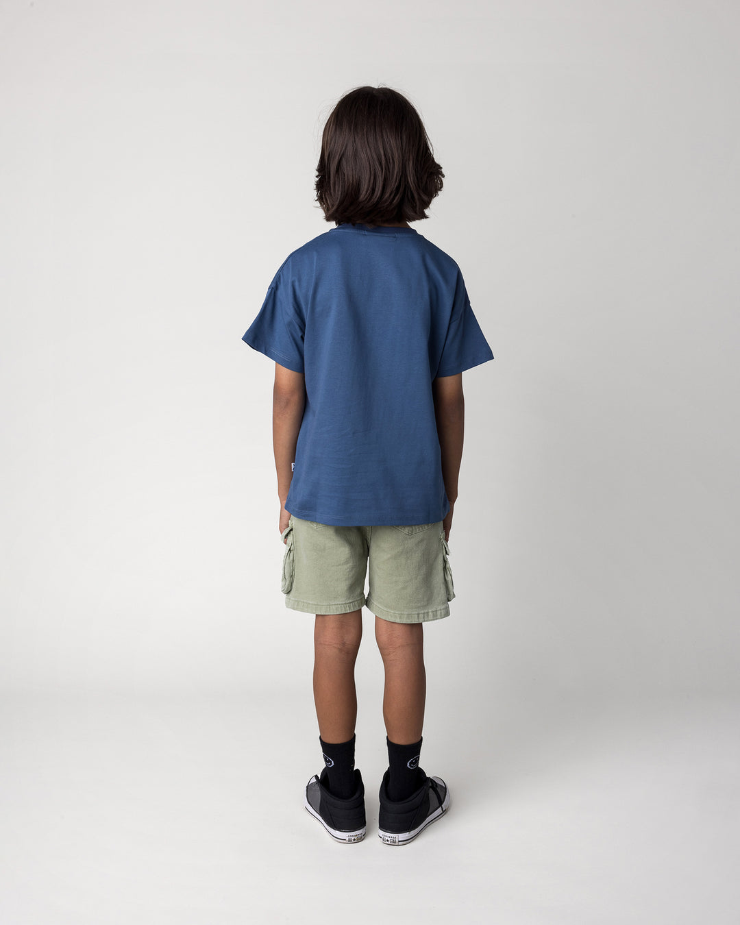 Kid wearing the Rad Croc Tee in blue, back view