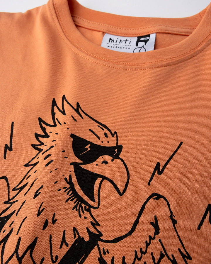 Close up of the Rock Griffin Tee print in light orange