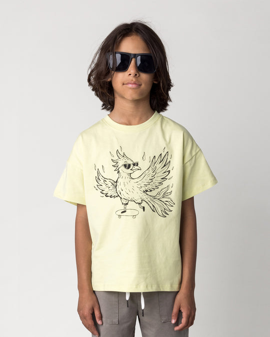 Close up of the Skate Phoenix Tee in light zest on a kid, front view