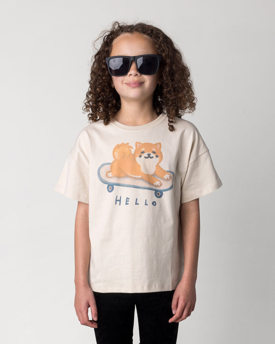 Close up of the Skate Puppy Tee in stone on a kid, front view