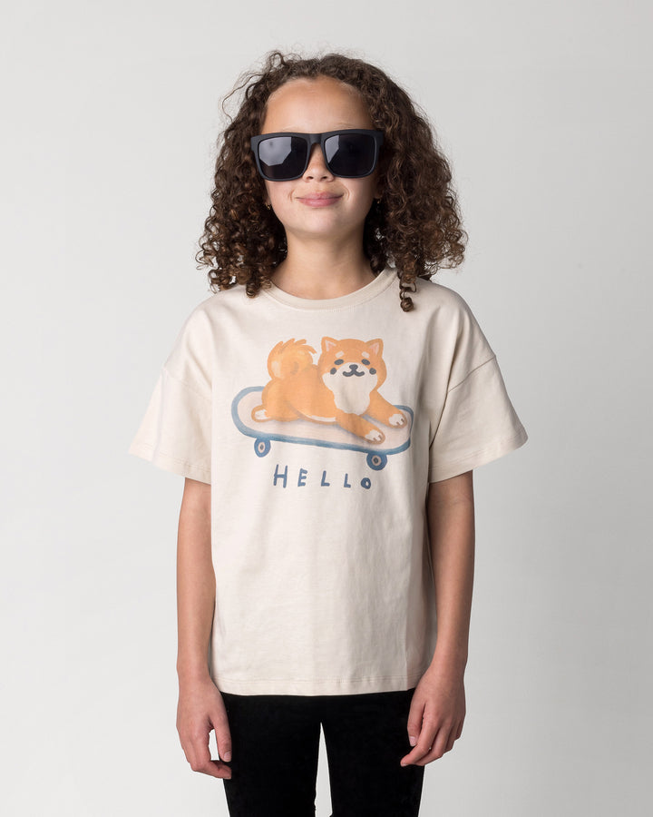 Close up of the Skate Puppy Tee in stone on a kid, front view