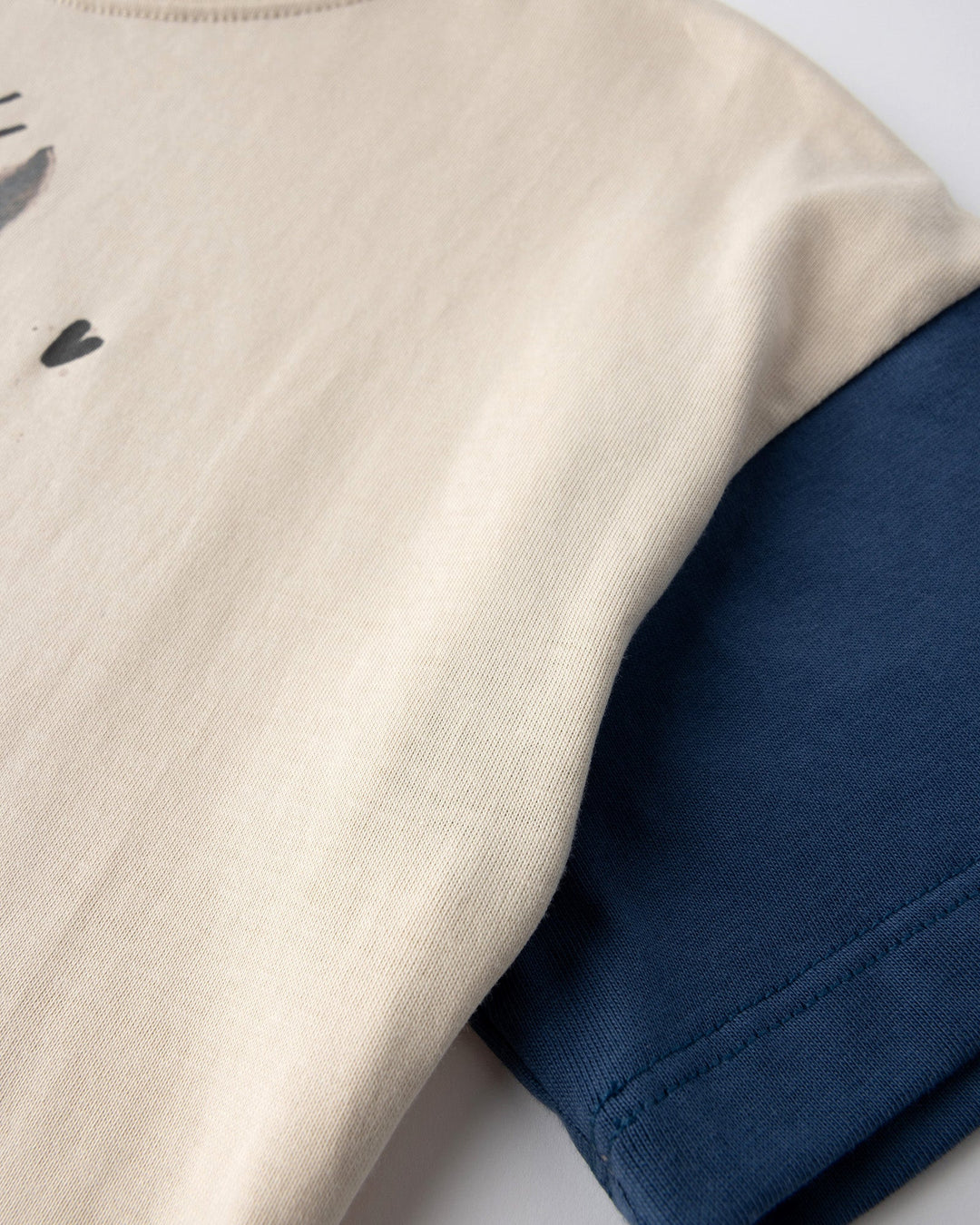Close up detail of the Watercolour Unicorn Tee in stone and midnight